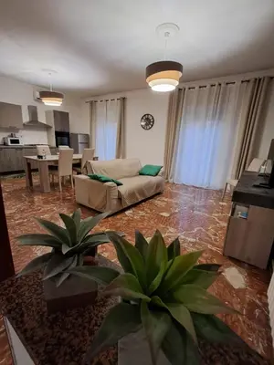 a living room with a couch and a table at Casa Kennedy in Capaci