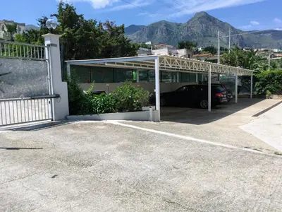 a garage with a car parked in it at Casa vacanze mare Rosa in Castellammare del Golfo