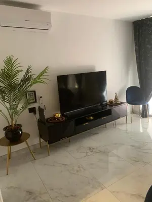 a living room with a large flat screen tv at Ai Chiavettieri Suite in Palermo