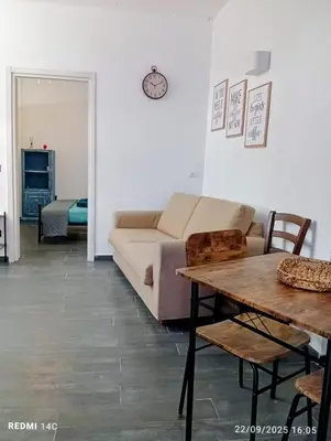 a living room with a couch and a table at Sicily Bed' House in Palermo