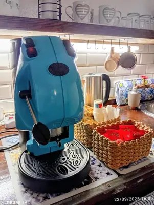 a blue mixer sitting on top of a kitchen counter at Sicily Bed' House in Palermo