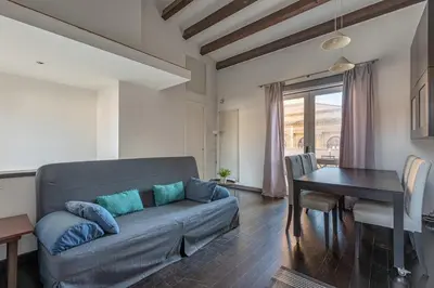 a living room with a couch and a table at La Terrazza sul Massimo in Palermo