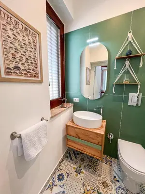 a bathroom with a sink and a mirror at B&B Il Mare di Terrasini in Terrasini