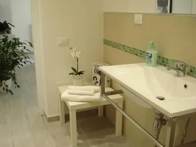 a bathroom with a sink and a mirror at Appartamento Cantieri-Porto,Palermo in Palermo