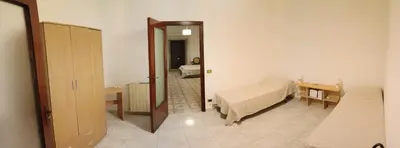 a room with a bedroom with a bed and a mirror at Casa la B a n d i t a in Palermo