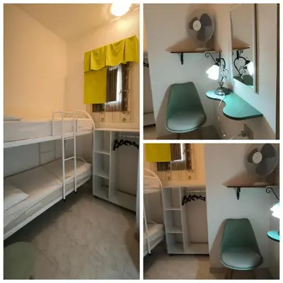 a bedroom with a large bed and two tables at casa vacanza san vito lo capo in San Vito lo Capo