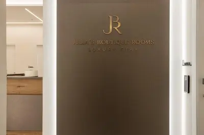 a sliding door in a kitchen with the letter r on it at Julia's Boutique Rooms in Palermo