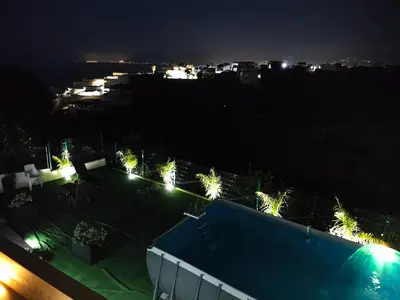 a view of a swimming pool at night with lights at Villa Stella in Alcamo