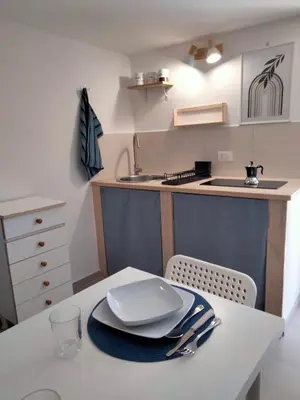 a kitchen with a table with a plate on it at Casa Nadir in Palermo