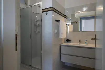 a bathroom with a shower and a sink at Trabia Villa Bedda Mia B in Trabia