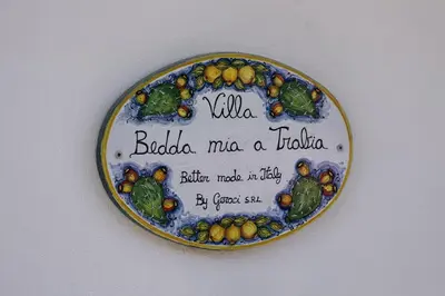 a plate of fruits and vegetables on a wall at Trabia Villa Bedda Mia B in Trabia