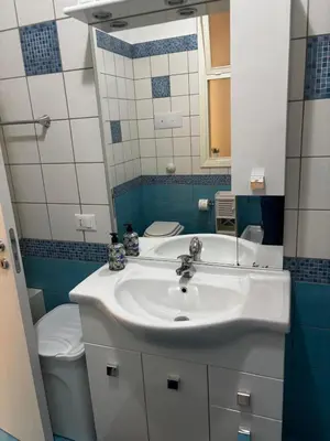a bathroom with a sink and a toilet at Casa Sulia in Terrasini