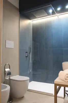 a bathroom with a shower with a toilet and a sink at Le Onde della Sicciara in Balestrate