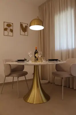 a table with a bottle of wine on top of it at Le Onde della Sicciara in Balestrate