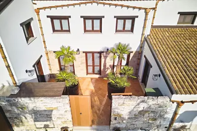 an aerial view of a house with palm trees at Villa Palme in Alcamo Marina