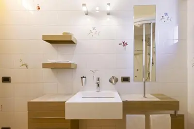 a bathroom with a sink and a shower at Villa Palme in Alcamo Marina