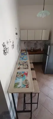 a long table in a kitchen with plates on it at Villa Alba in Palermo