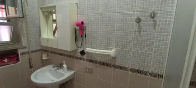 a bathroom with a sink and a mirror at Villa Alba in Palermo
