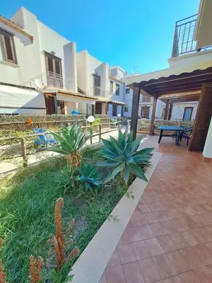 a courtyard of a house with plants in the yard at Casa Tonnarella San Vito Lo Capo in San Vito lo Capo