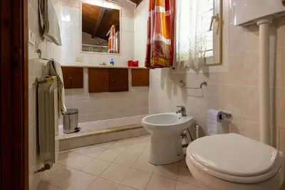 a bathroom with a toilet and a sink at Gulliver's Nest in Castellammare del Golfo