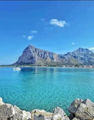 a view of a lake with mountains in the background at Katia Home - San Vito lo Capo in San Vito lo Capo