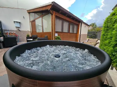 a large pot of water in front of a house at la casetta del baglio in Monreale