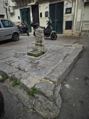 a scooter parked on the side of a street at La Casuzza 2 in piazzetta in Palermo