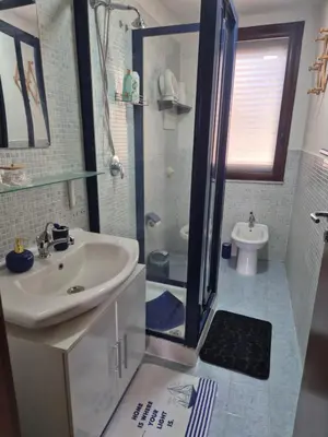 a bathroom with a sink and a shower and a toilet at La Casuzza 2 in piazzetta in Palermo