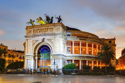 a building with a statue on top of it at Vucciria Holiday - Centro storico - via Emanuele in Palermo