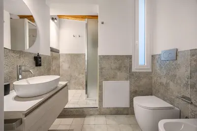 a bathroom with a sink and a toilet at Appartamento Amari 148 in Palermo