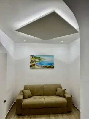 a bathroom with a white sink and a toilet at Terrasini Center Apartments in Terrasini