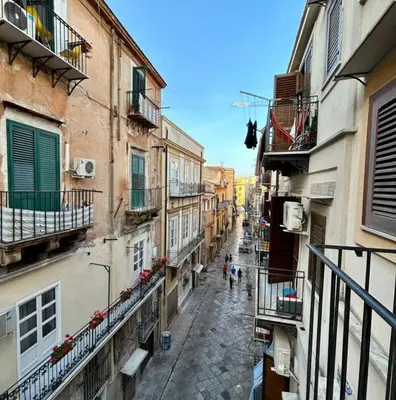 a view of an alley with people walking down the street at Casamori 1-centro storico Palermo in Palermo