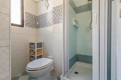 a bathroom with a toilet and a shower at GuestHost - La Rosa di Ballarò Palermo Apartment in Palermo