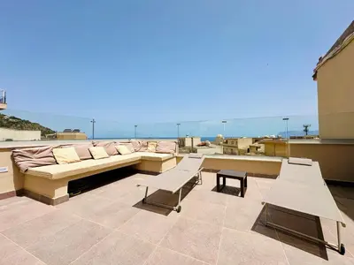 a living room with a couch and a table and chairs at Gs Vacantion's del Golfo con vasca idromassaggio in Castellammare del Golfo