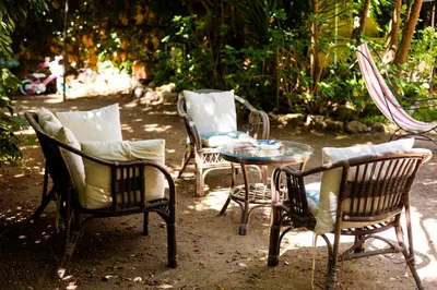 a group of chairs and a table in a yard at Principe di Castelnuovo Historical Suites in Palermo