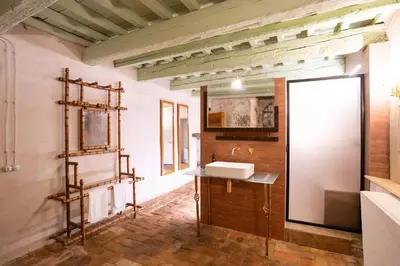 a bathroom with a sink and a mirror at Principe di Castelnuovo Historical Suites in Palermo