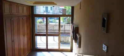 a hallway with an open door to a balcony at Molo Sbrijù - Palermo Centro in Palermo