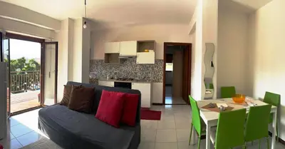a living room with a couch and a table at Molo Sbrijù - Palermo Centro in Palermo