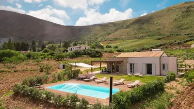 a villa with a swimming pool in a mountain at Villa Manù country house in Castellammare del Golfo