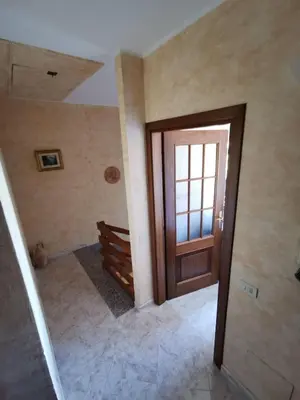 an empty room with a door and a staircase at Località Cefalù - Villa indipendente con giardino in Lascari