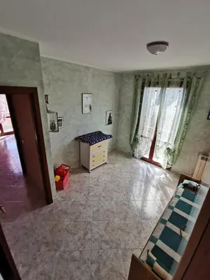 a living room with a couch and a table at Località Cefalù - Villa indipendente con giardino in Lascari