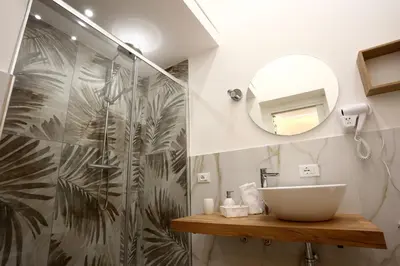 a bathroom with a sink and a shower at Front Palermo House in Palermo