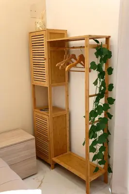 a wooden book shelf in a bedroom at Front Palermo House in Palermo