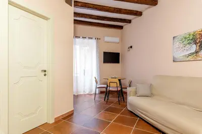 a living room with a couch and a table at Alabardieri Apartments by Wonderful Italy in Palermo