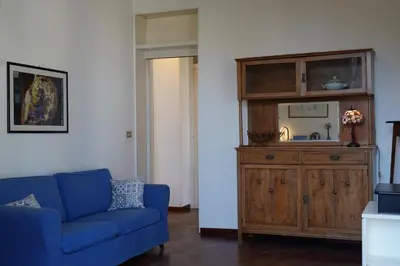 a living room with a dresser and a mirror at Sirene Blu Mondello in Palermo