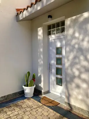 a plant in a pot sitting next to a door at Villa Falco in Carini