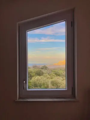 a window in a room with a view of trees at Villa Falco in Carini
