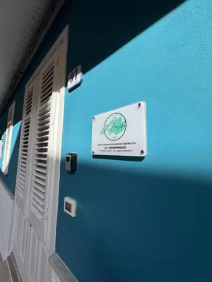 a blue building with a sign on the side of it at St Joseph in Terrasini