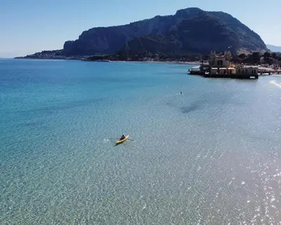 a person in a boat in a body of water at Finestra sul Golfo in Mondello