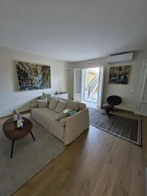 a living room with a couch and a table at Finestra sul Golfo in Mondello